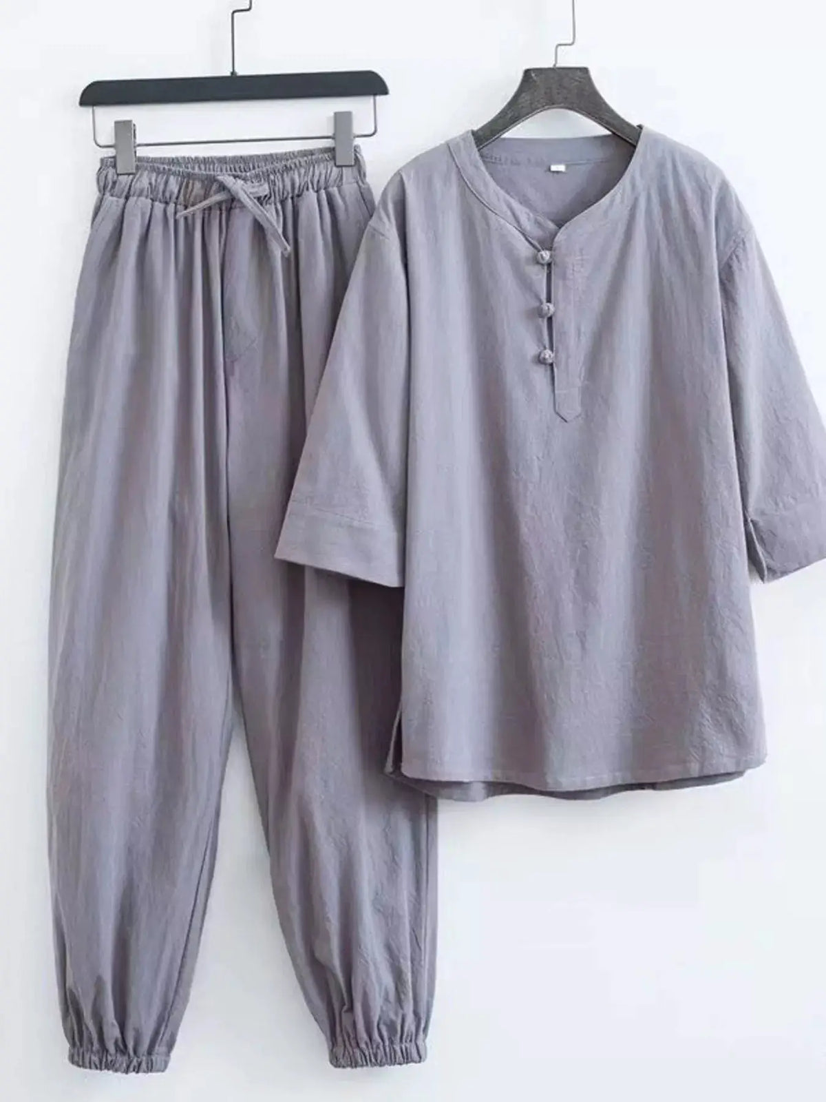 Men's plus-size Chinese-style pajama set in gray with mandarin-collar top and matching drawstring pants by Trendsi