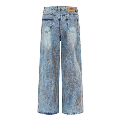 Pantalon en denim délavé, coupe droite oversize.