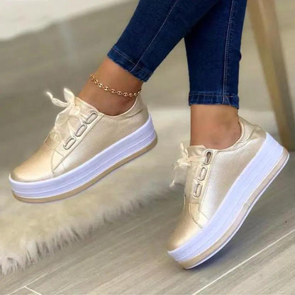 AdTec platform lace-up sneakers, gold metallic, round toe, white thick sole pair