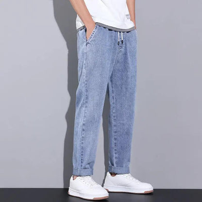 AdTec men's loose wide-leg denim jeans with drawstring elastic waistband, light wash, cuffed hems