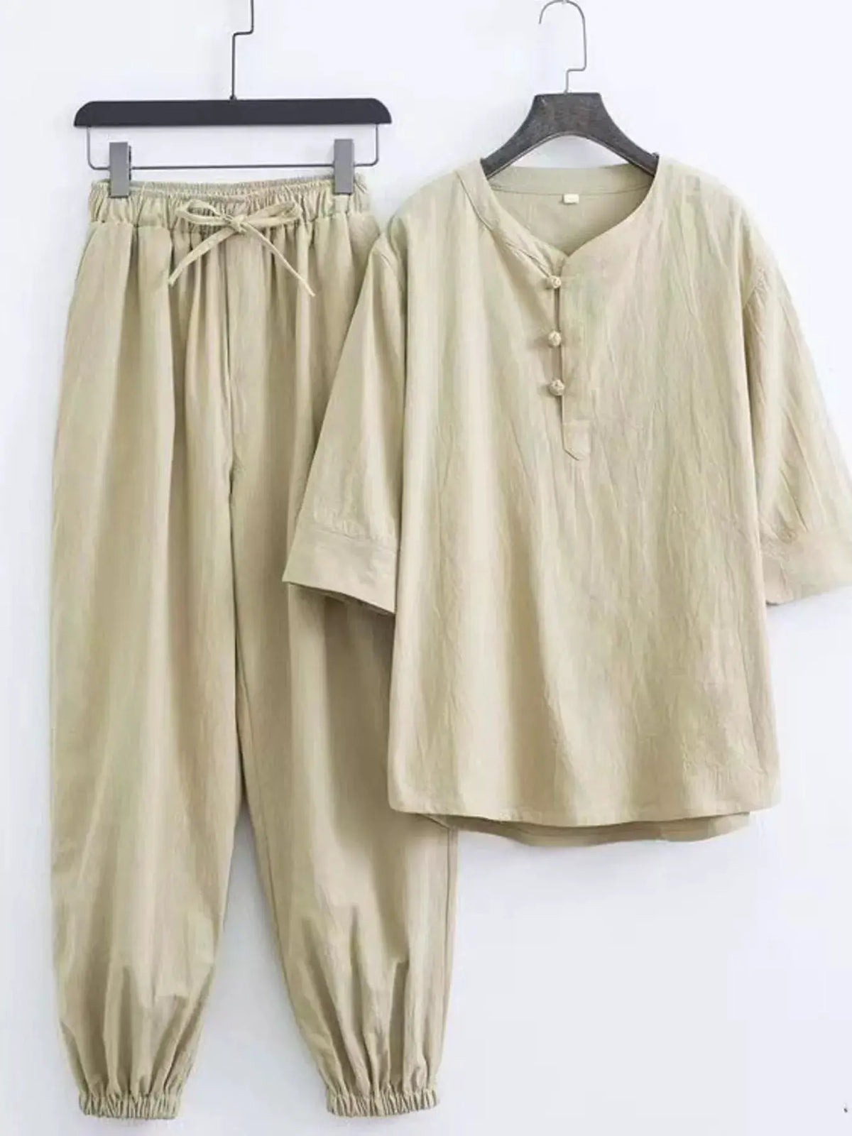 Men's plus-size Chinese-style pajama set in beige with a buttoned mandarin-collar top and drawstring pants (2-piece).