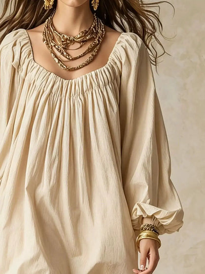 Flowy Balloon Sleeve Mini Dress in beige with gathered neckline and long sleeves