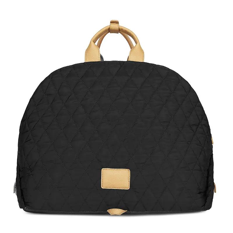 Pet Handbag for outdoor cats by AdTec, black quilted bag with tan leather handles.