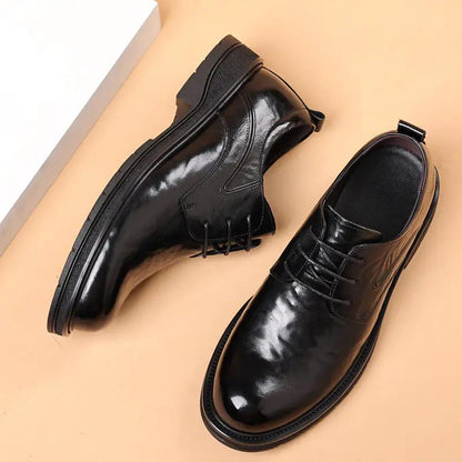 Men's black leather dress shoes with thick soles, lace-up