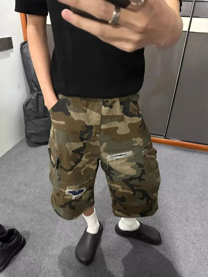 Mens plus size camo cargo denim shorts with distressed detailing, knee-length, knee rips, and cargo pockets