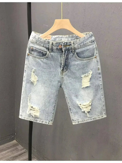 Men's relaxed distressed washed cotton denim shorts, light wash with ripped knees