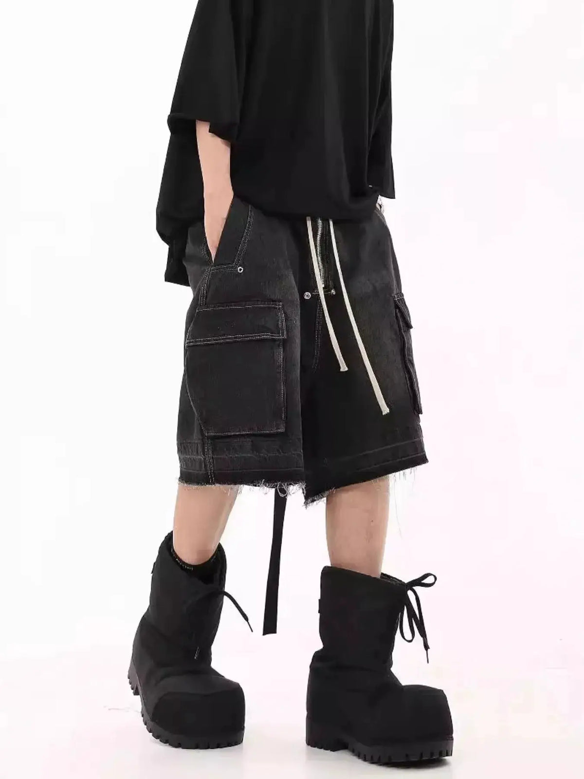 Mens loose-fit cargo denim shorts with drawstring and front zipper, black wash with multiple pockets