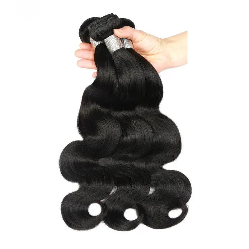 AdTec African Wigs synthetic hair extensions bundles in black, held by hand