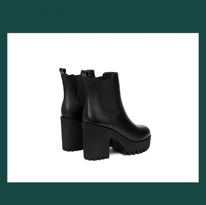 Women's black genuine leather Chelsea boots, a pair with chunky platform heels and lug soles.