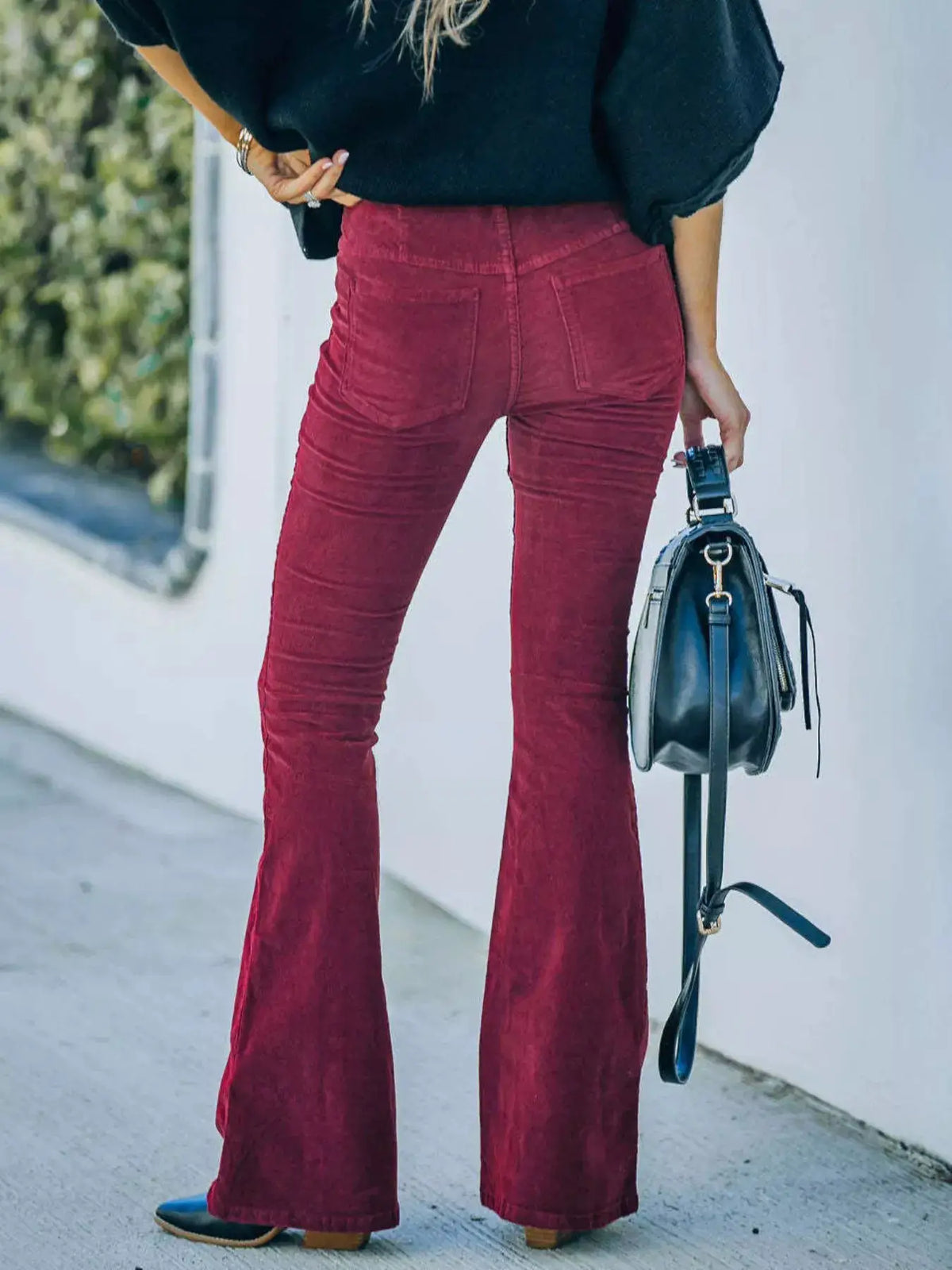 Full Size Corduroy Flare Pants Plus Size by Trendsi; burgundy corduroy fabric, back view.