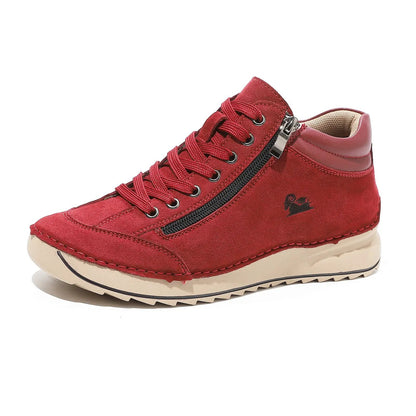 Flat dress shoe for women in red suede with lace-up front and side zipper.