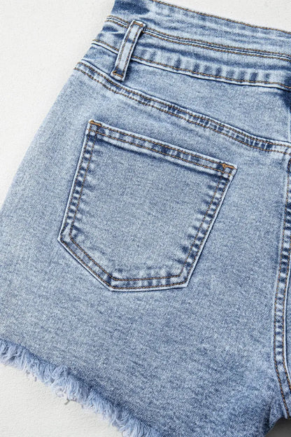 Women’s light-wash denim shorts with back pocket and raw frayed hem