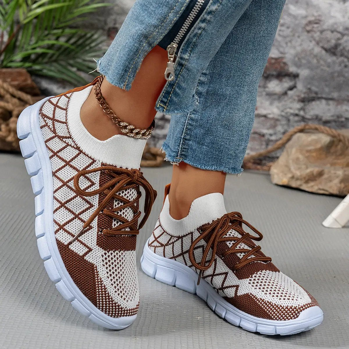 Women’s colorblock plaid knit sneakers with brown laces, white sole, breathable mesh for walking.