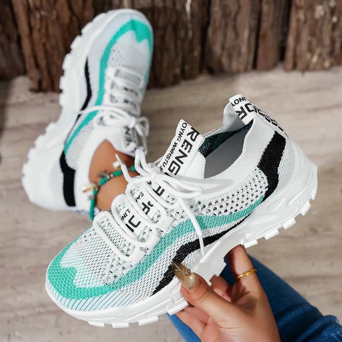 Women's AdTec lightweight casual sneakers, white knit mesh with teal and black accents and soft-bottom sole.