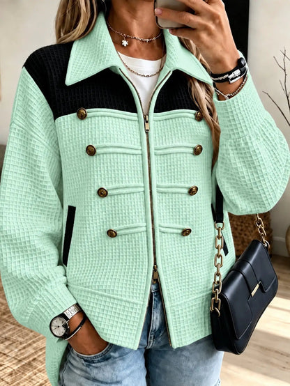 Lady's mint-green quilted jacket with black yoke, gold-tone buttons, and front zipper
