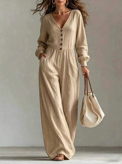 Womens beige V-neck long-sleeve jumpsuit with pockets and button placket, wide-leg.