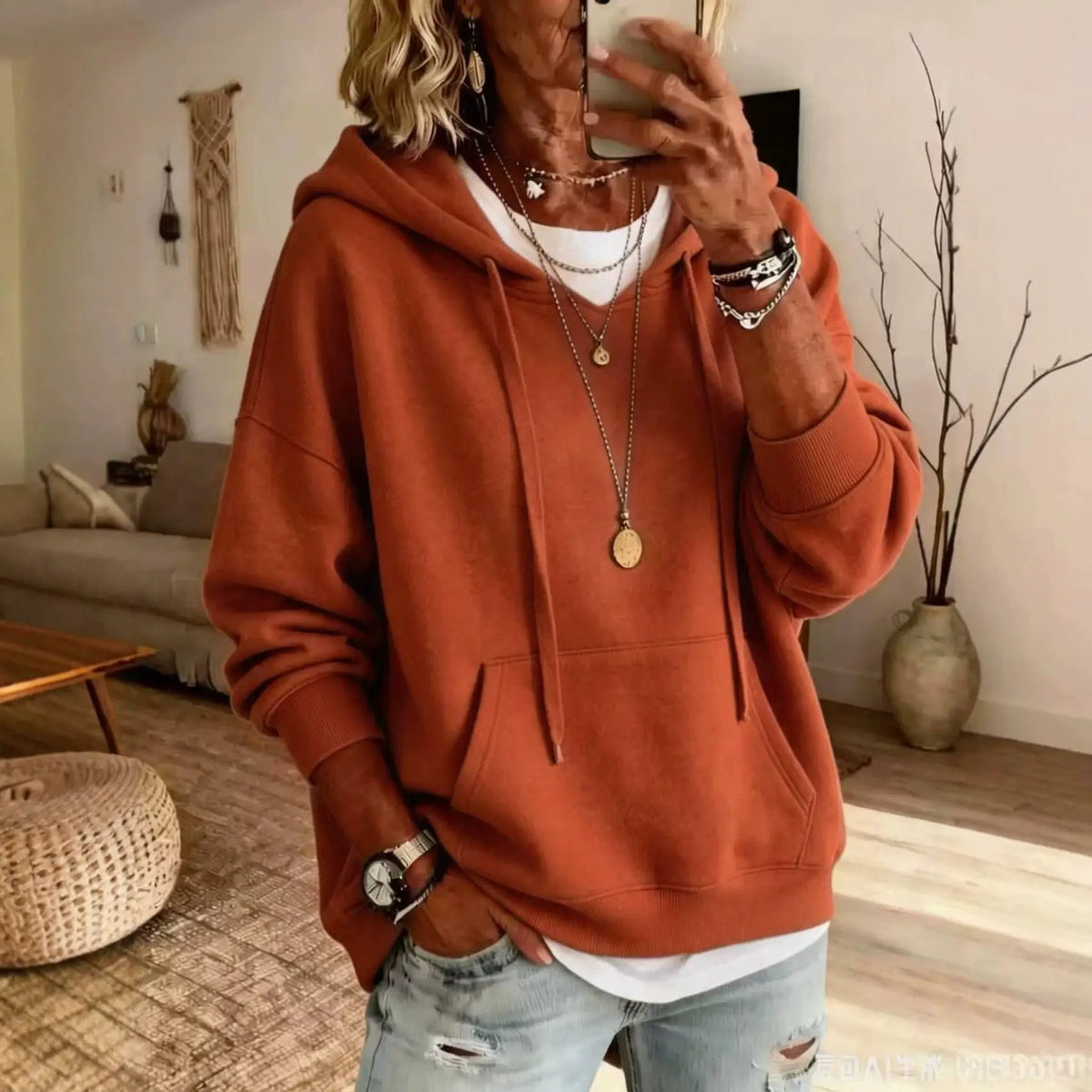 Women's rust-orange casual hoodie, loose-fitting with front pockets and long sleeves