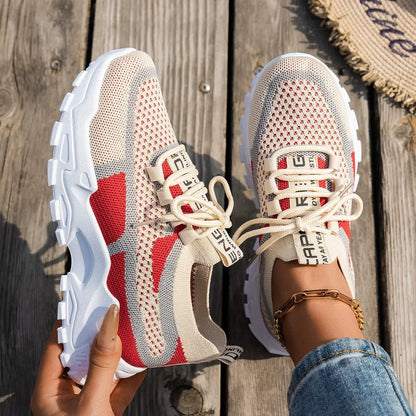 Pair of Flyknit mesh shoes for women, beige with red accents, breathable lace-up walking running casual shoes.