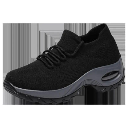 Women’s black knit athletic sneaker with gray midsole and chunky outsole.