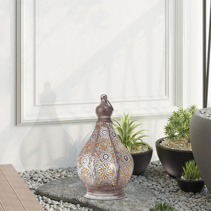 11.5in battery-powered table lamp in a ceramic teardrop shape with brown finish and orange-white geometric cutout pattern