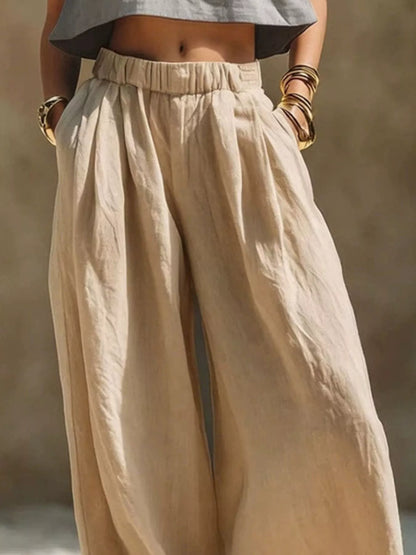 Plus-size beige palazzo pants with elastic waistband, drawstring and pockets