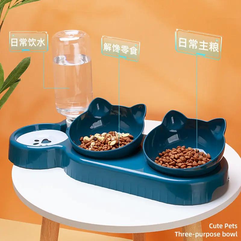 Double-bowl blue pet feeder by AdTec with two cat-ear bowls and automatic drinking water dispenser.