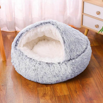 AdTec Deep Sleep semi-enclosed plush round pet bed, blue-gray exterior with white fluffy interior (donut-style).
