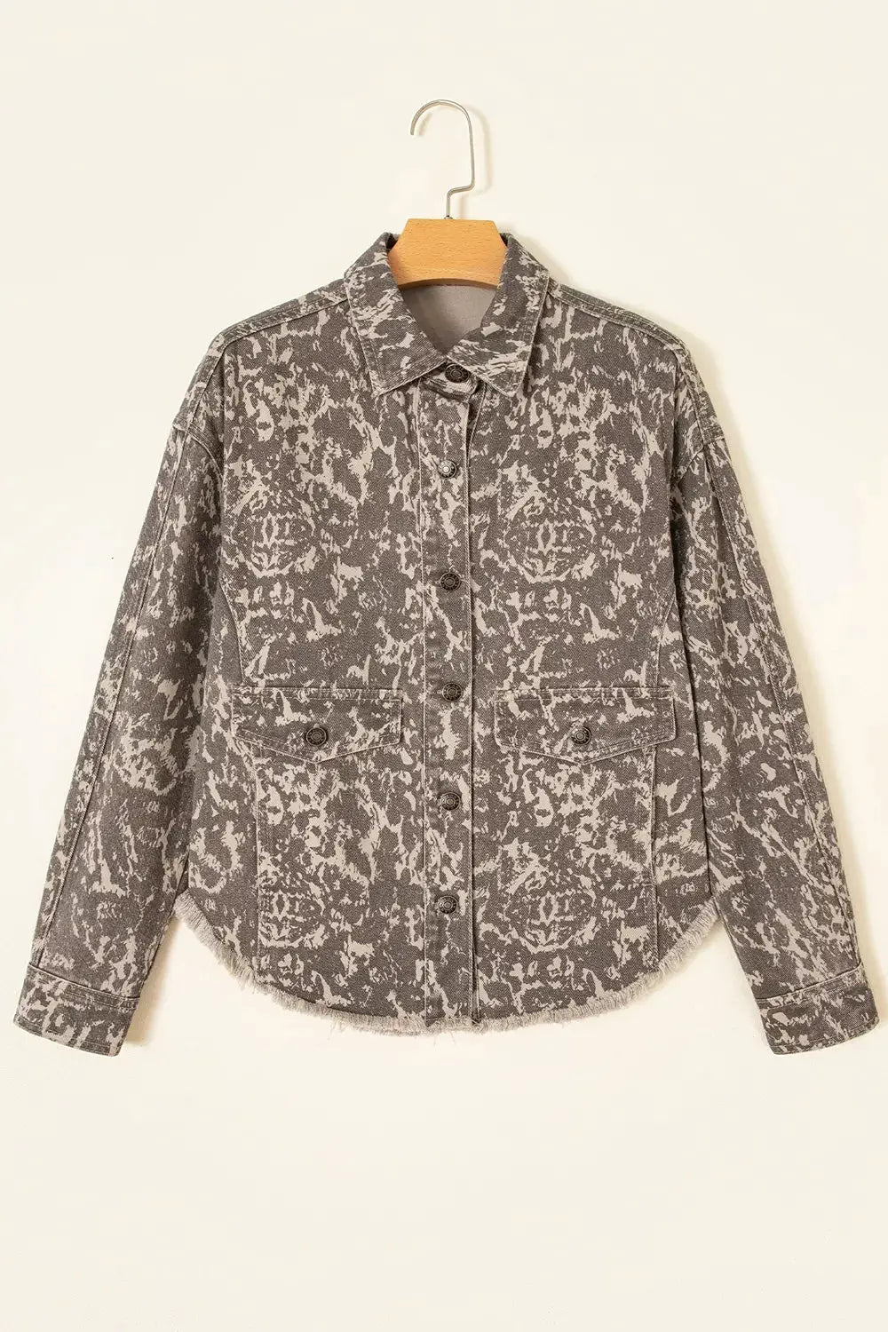 Abstract print denim jacket, grey acid-wash with long sleeves, button-front and raw hem.