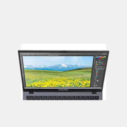 CHUWI laptop with dark gray chassis and open display showing scenic meadow and mountains