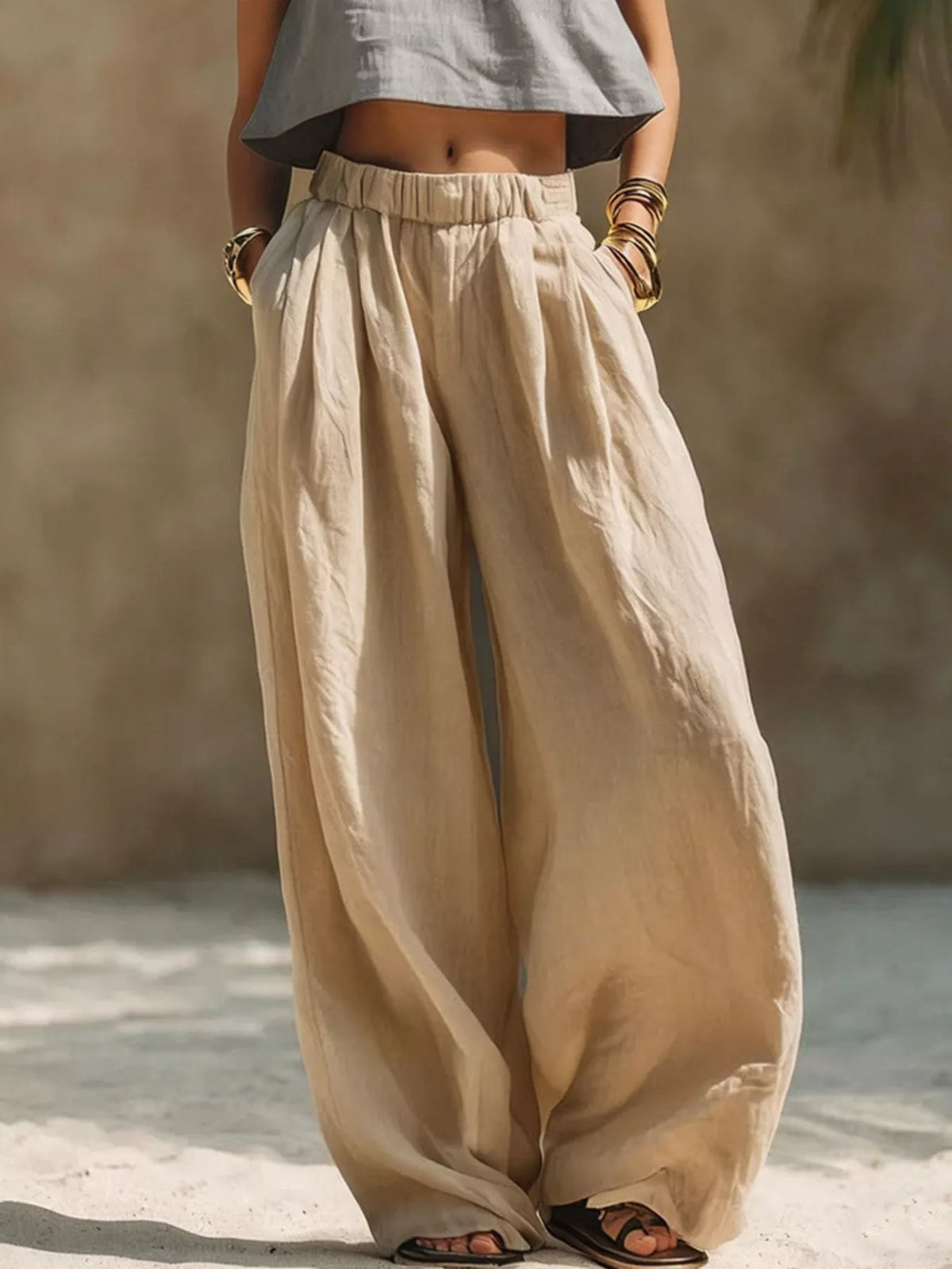 Plus-size beige Palazzo pants with elastic waistband, wide-leg silhouette, drawstring and pockets