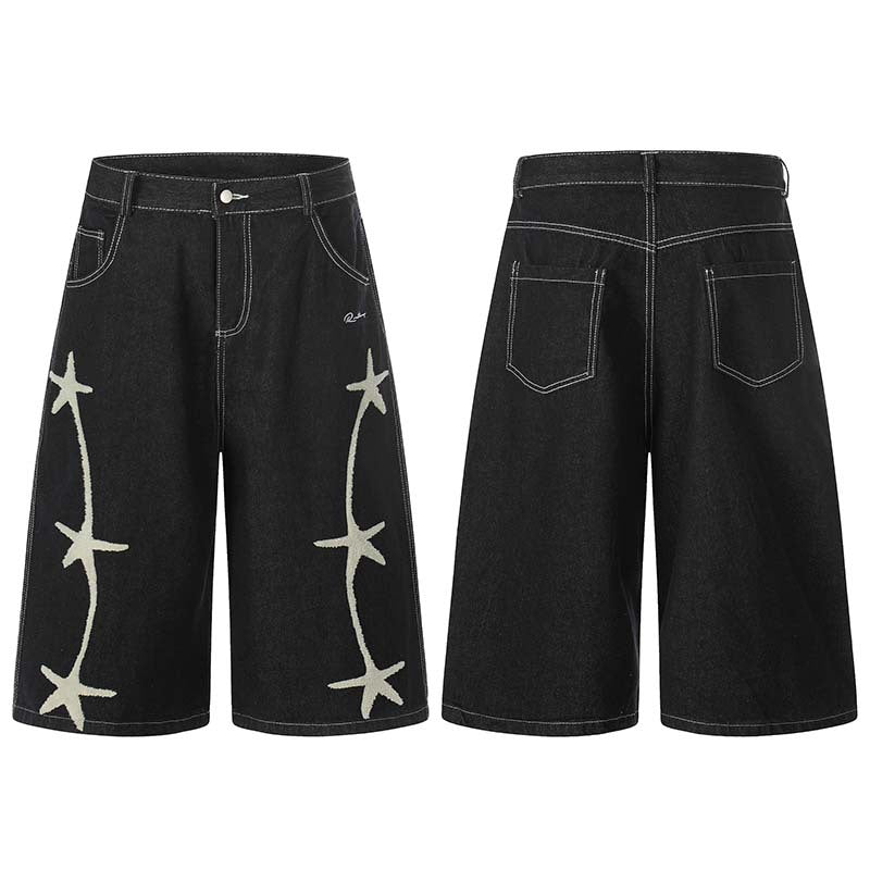 Black washed denim cropped shorts with white star embroidery along the sides