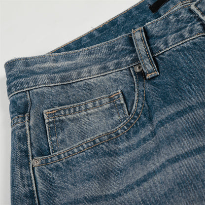 Jean en denim délavé et poli à blocs de couleur