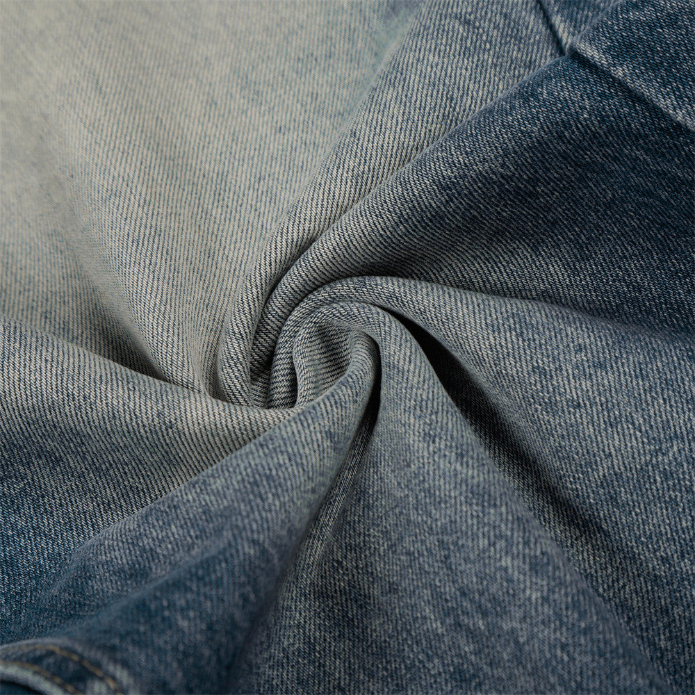 Jean en denim délavé et poli à blocs de couleur