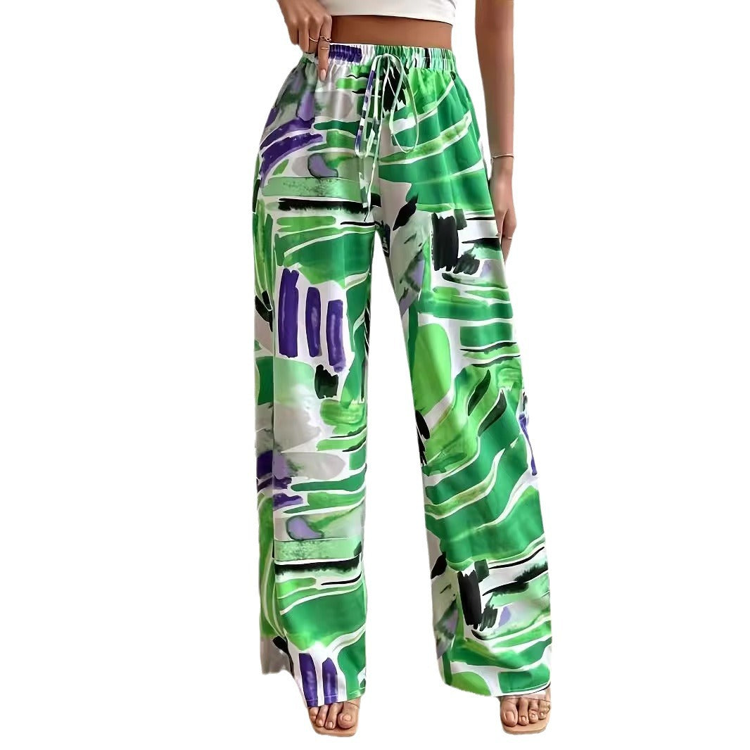 Elastic waist wide-leg pants in green abstract print with drawstring; casual trousers by eprolo