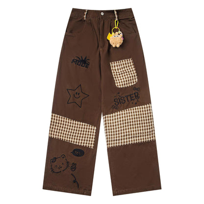 Jeans patchwork à carreaux brodés motif dessin animé