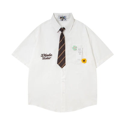 Chemise brodée fleur broche dopamine