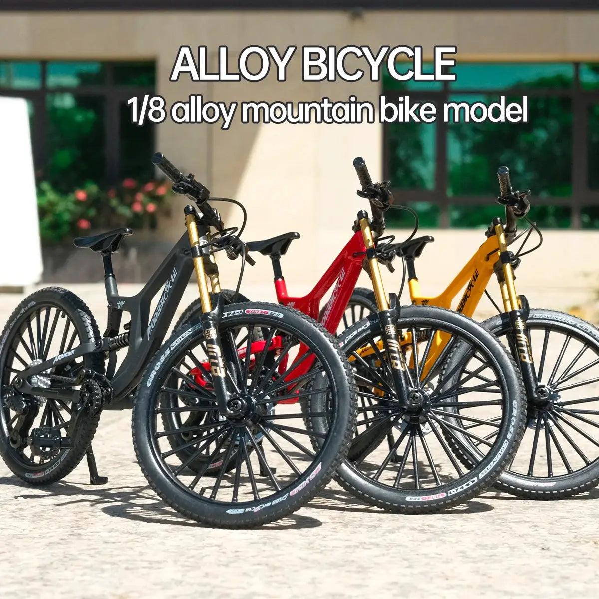 Three 1:8 alloy European mountain bikes with black, red and yellow frames