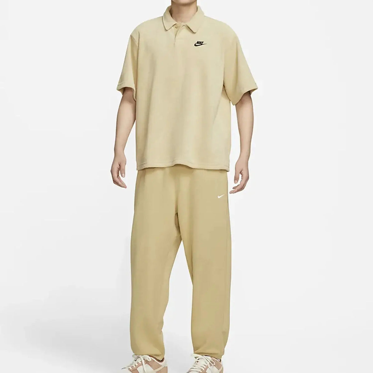 Nike tan towel-cloth short-sleeve polo and matching pants 2-piece set with visible swoosh logos