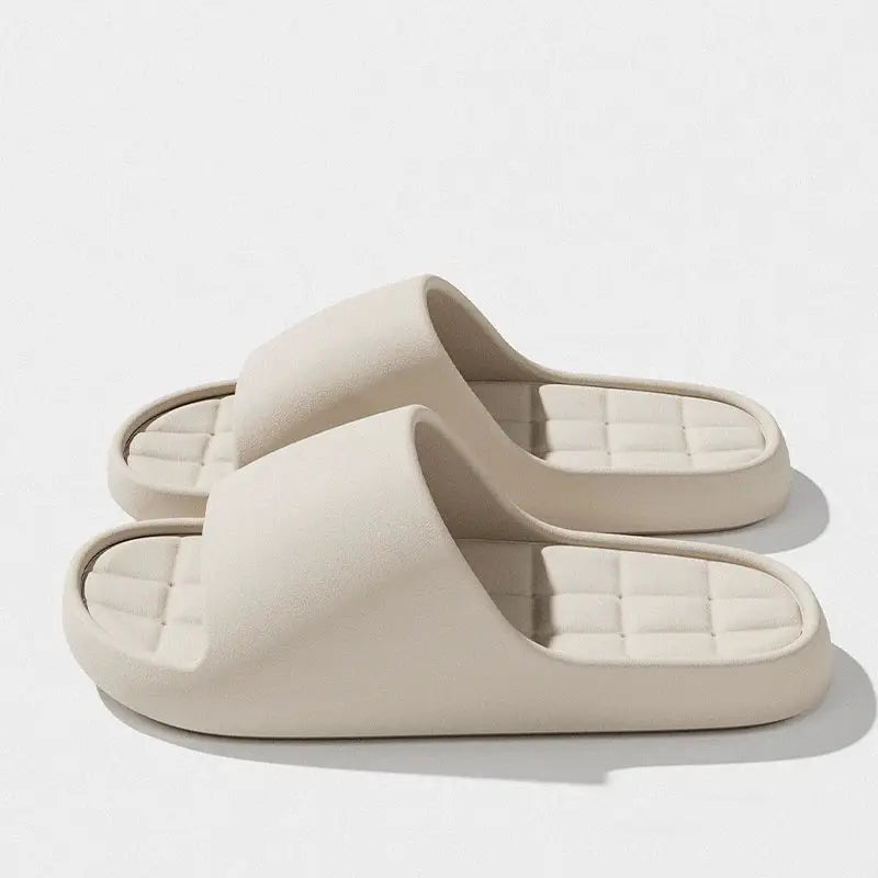 Beige unisex slide sandals with wide strap and quilted cushioned footbed