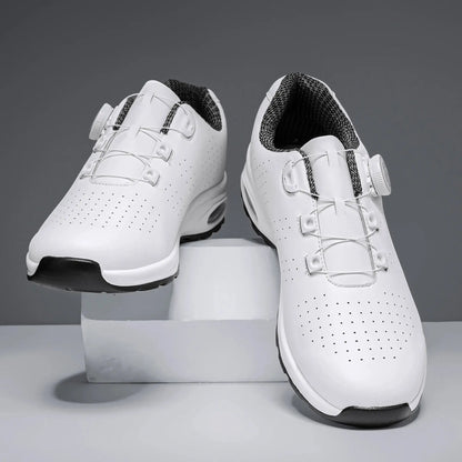 Two white Simple Nen's casual shoes with breathable perforated uppers and air-cushioned soles