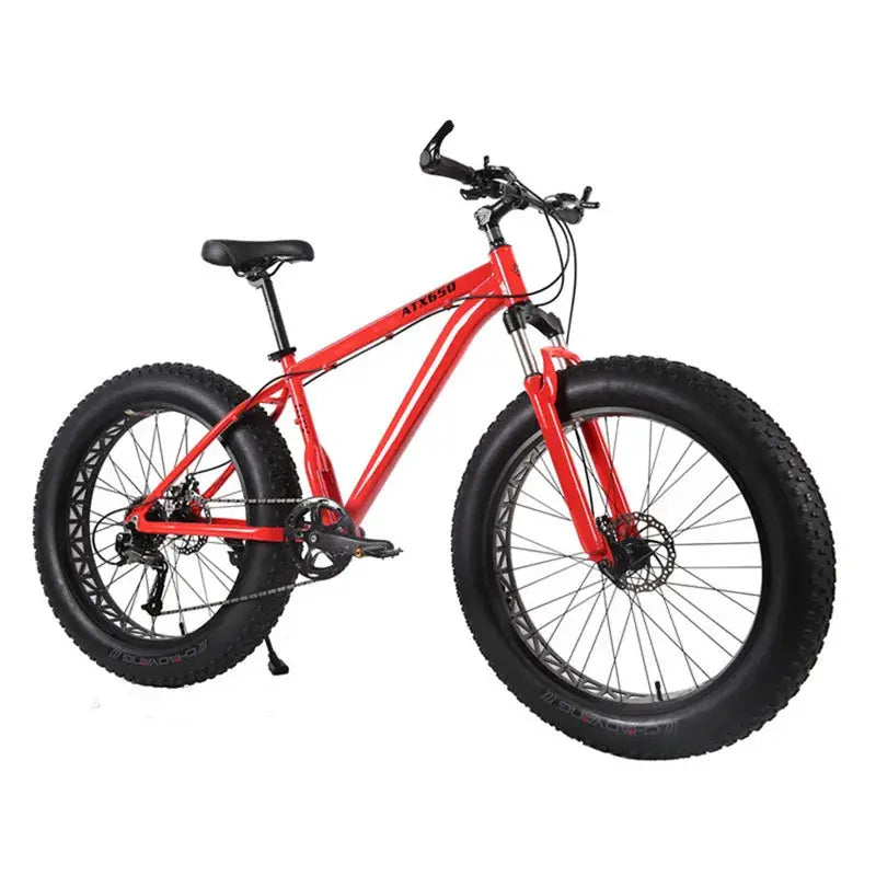 Fat bike with red aluminum frame and 26x4.0 fat tires for adults