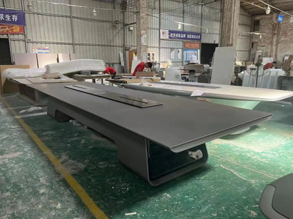 Large executive rectangular conference table in dark gray with a modern curved pedestal base