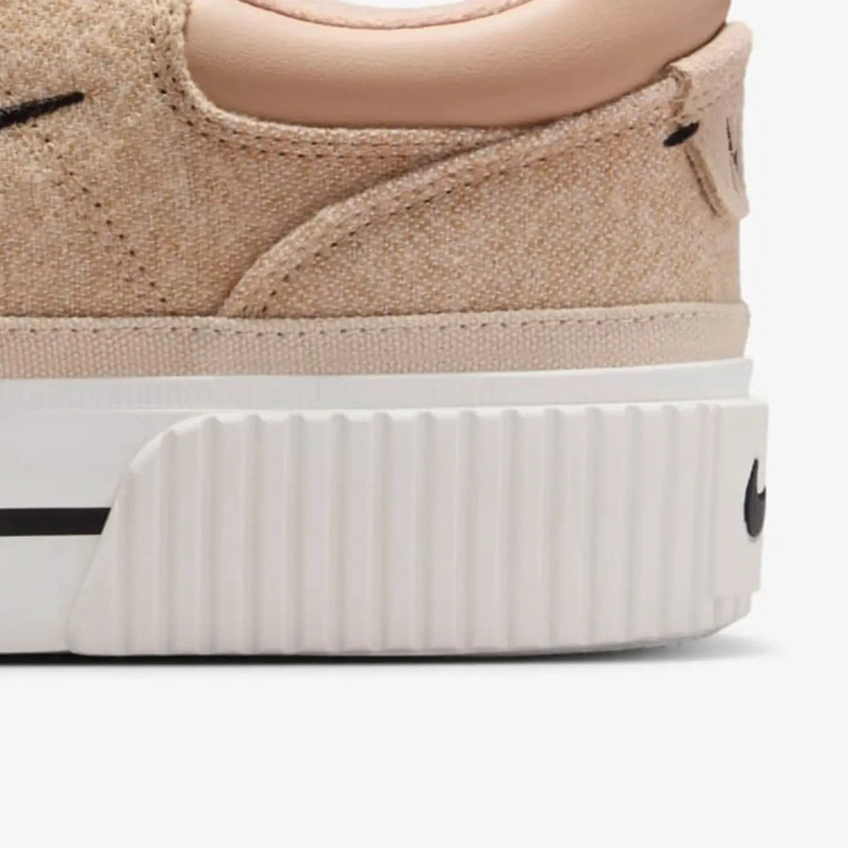 Nike Court Legacy Lift women's beige suede sneakers with white chunky platform sole.