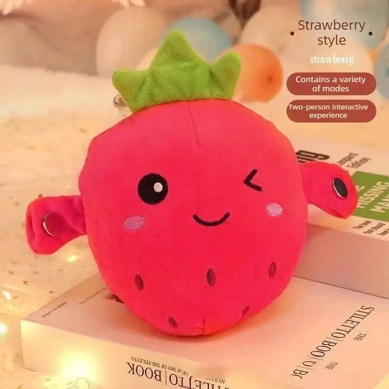 Strawberry plush toy for kids, pink with a green leaf, winking face, soft fabric.