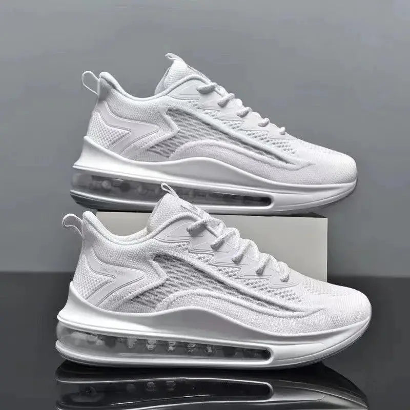 Pair of men's white running sneakers with breathable mesh upper and visible air-cushioned sole.