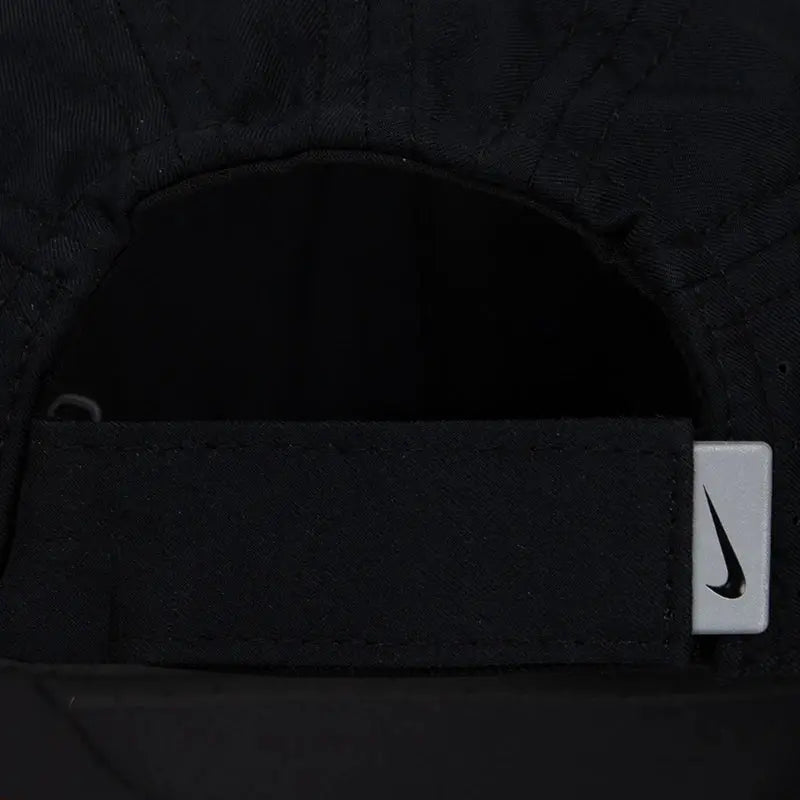 Nike black baseball cap with adjustable strap and swoosh logo tag