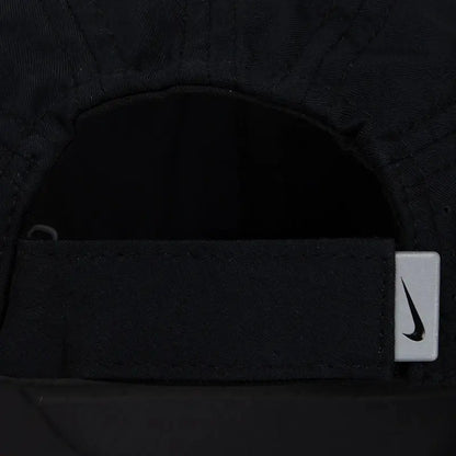 Nike black baseball cap with adjustable strap and swoosh logo tag