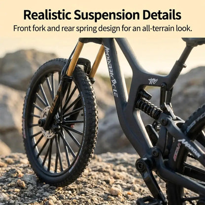 European 1:8 alloy mountain bike model with dual suspension; black frame, gold front fork, disc brakes on rocky terrain