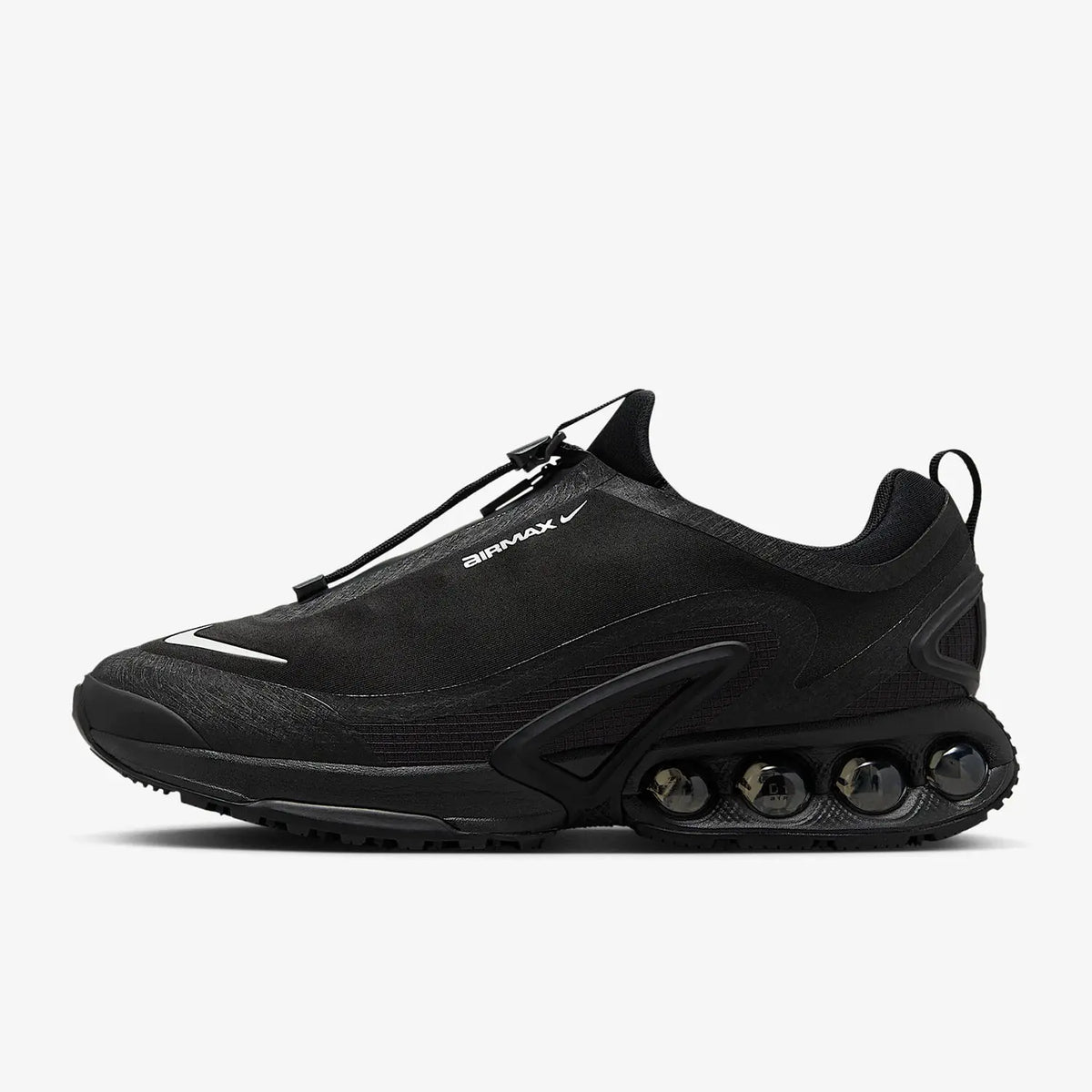 Nike Air Max Dn Roam men's black low-cut sneakers with white swoosh and visible Air Max cushioning pods.