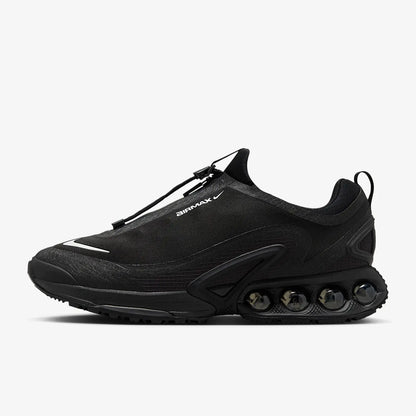 Nike Air Max Dn Roam men's black low-cut sneakers with white swoosh and visible Air Max cushioning pods.